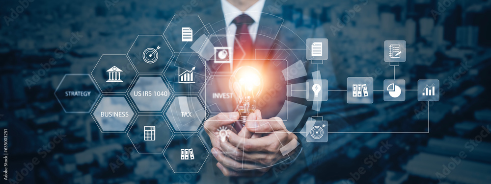 Businessman holding glowing light bulb with AI Data Management System on the computer, Hands working