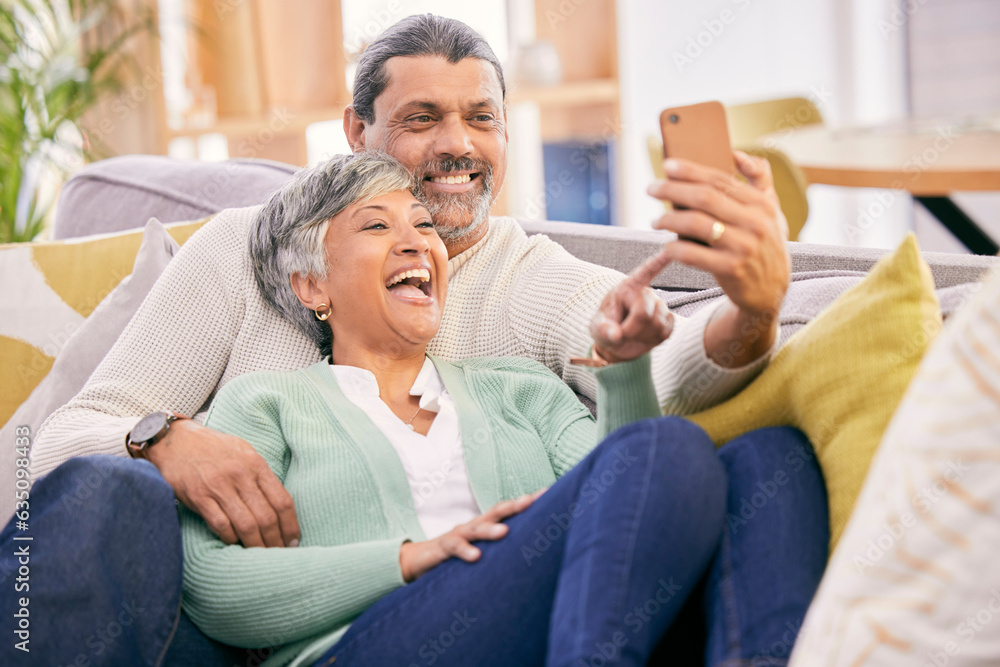 Mature couple, laugh and phone in home of social media post, meme or mobile app subscription. Happy 