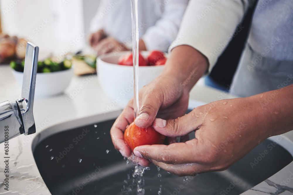 Water, tomato and hands cleaning vegetable for cooking in a kitchen basin or sink in a home for hygi