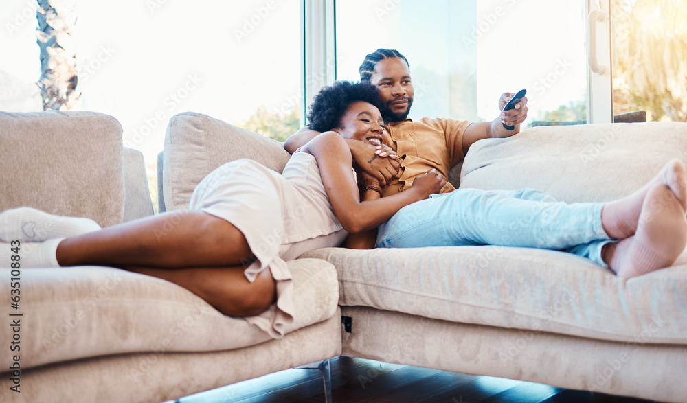 Couple, watching tv and relax on home sofa together with love, care and happiness. African man and w