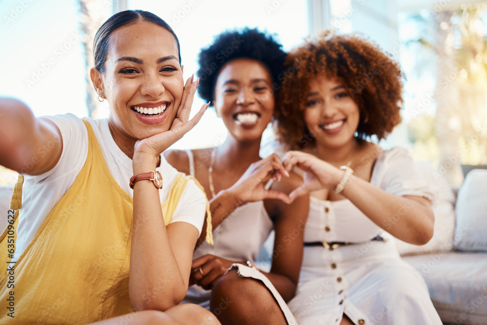 Portrait, heart hands and selfie of friends in home living room, bonding and having fun on sofa. Fac