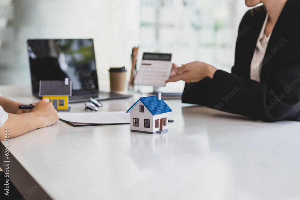 Businesswoman, real estate agent discussing the terms of the house purchase agreement contract docum