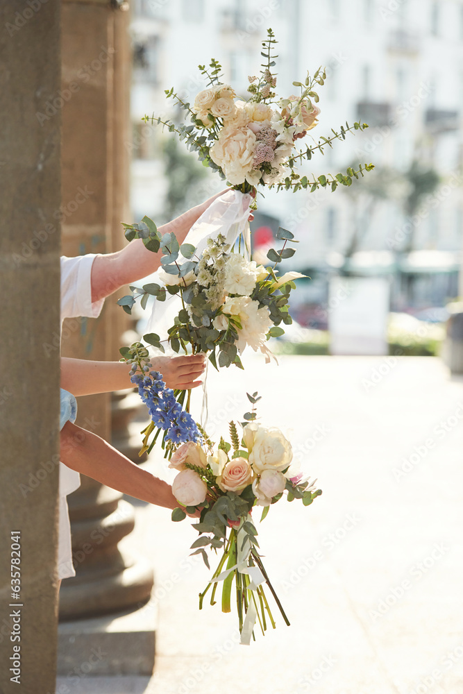 Close up view of women hands that are holding flowers