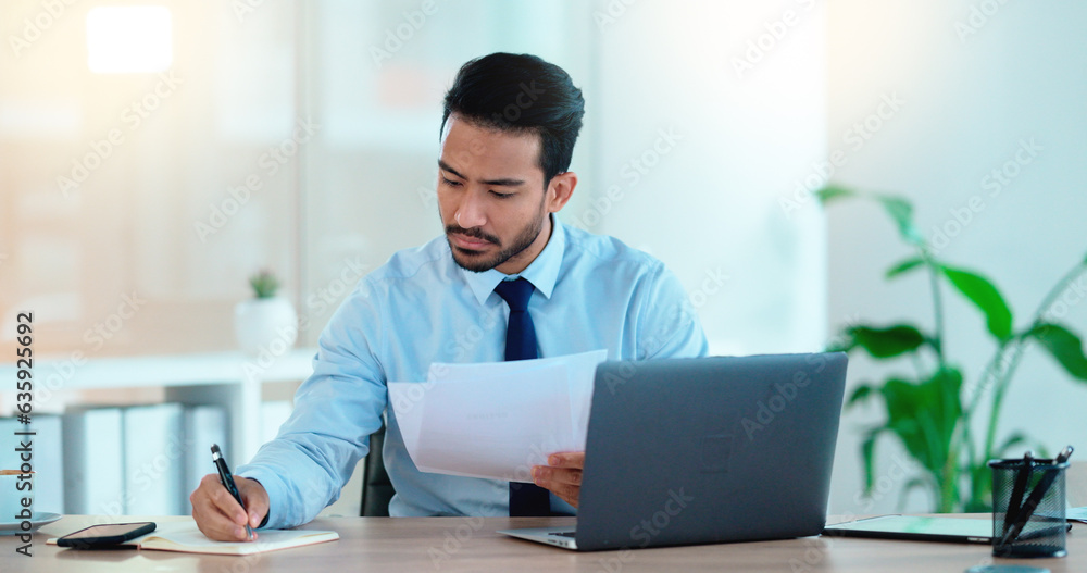 Lawyer and attorney working on corporate plans and compiling legal reports for a case at his desk. B