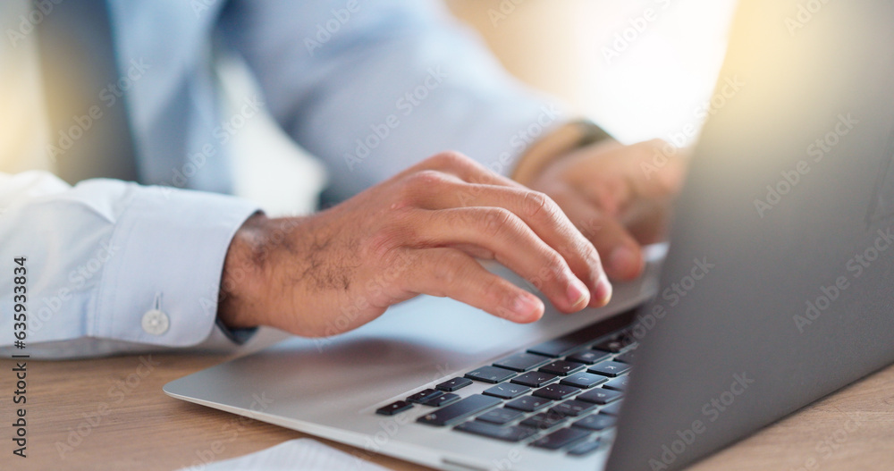 Lawyer sending emails on a laptop while working in a modern office. Closeup of advocate or legal ass