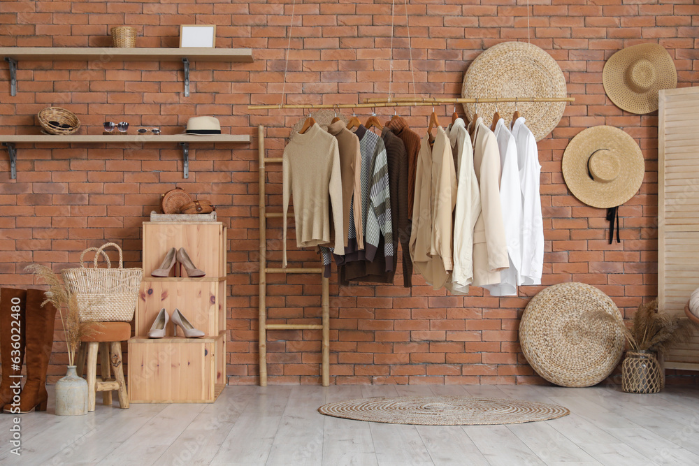 Interior of modern boutique with stylish female clothes and accessories