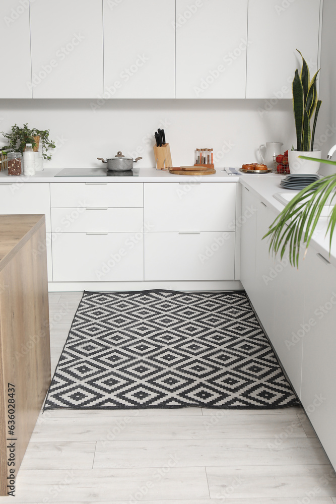 Stylish carpet in interior of modern kitchen