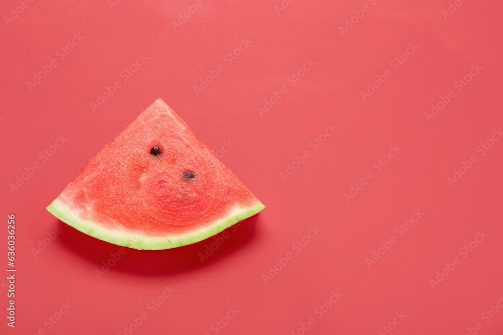 Piece of ripe watermelon on red background