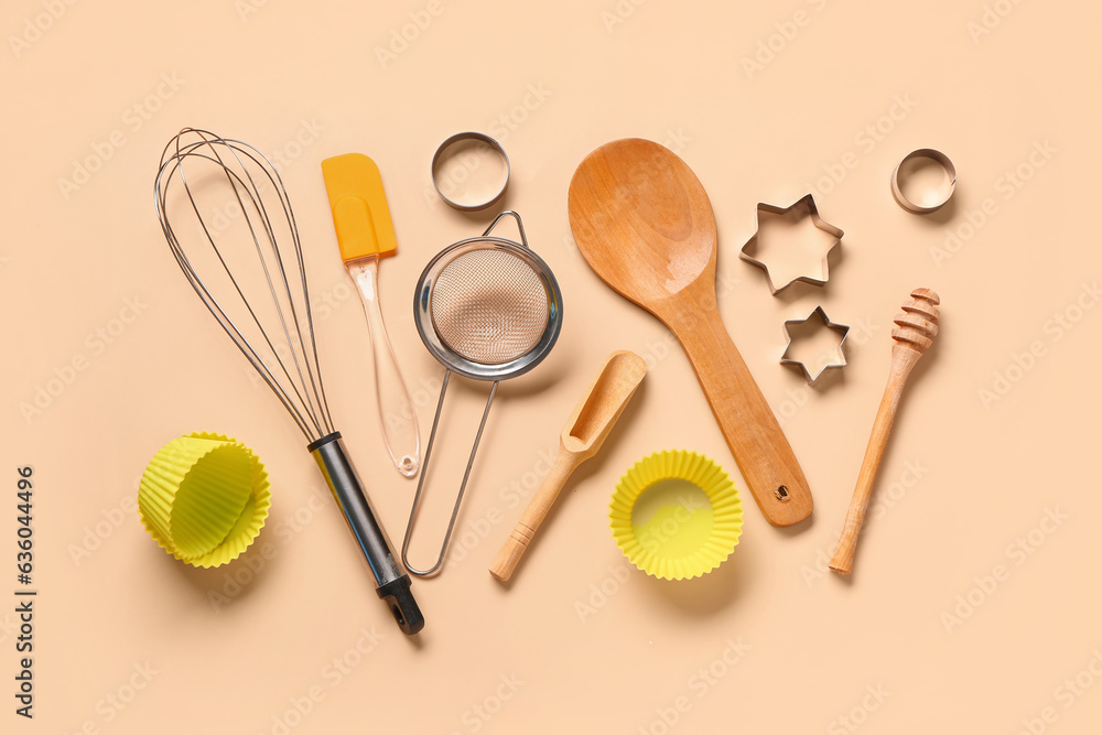 Baking utensils on beige background