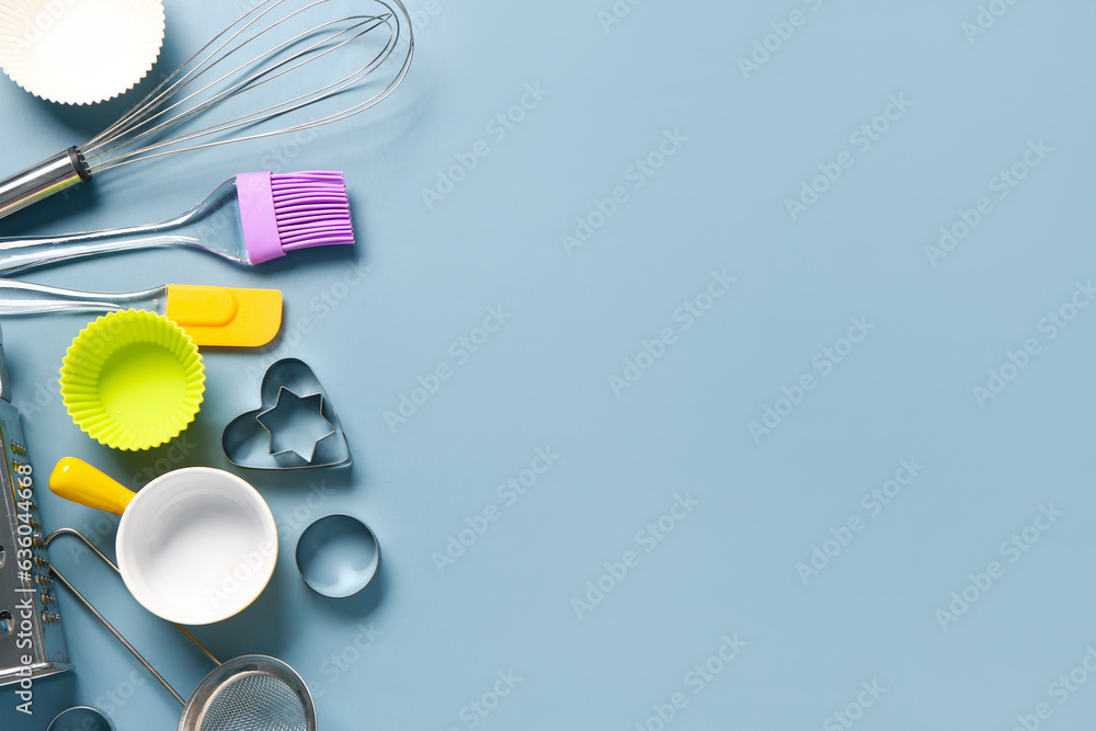 Baking utensils on blue background