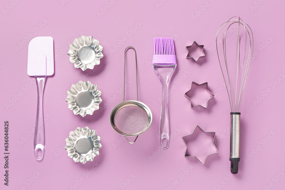 Baking utensils on pink background