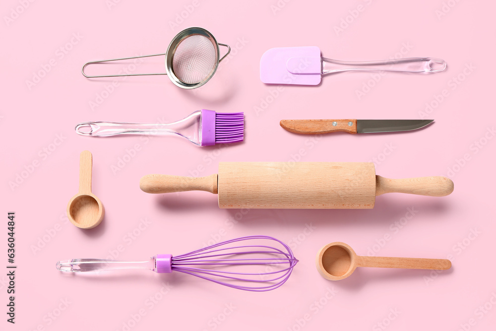 Baking utensils on pink background