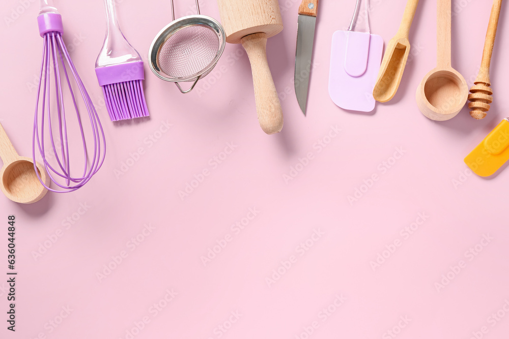 Baking utensils on pink background