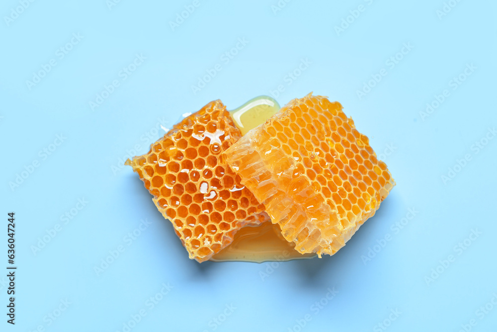 Sweet honeycombs on blue background