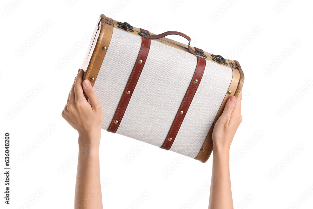 Female hands holding retro wooden suitcase on white background