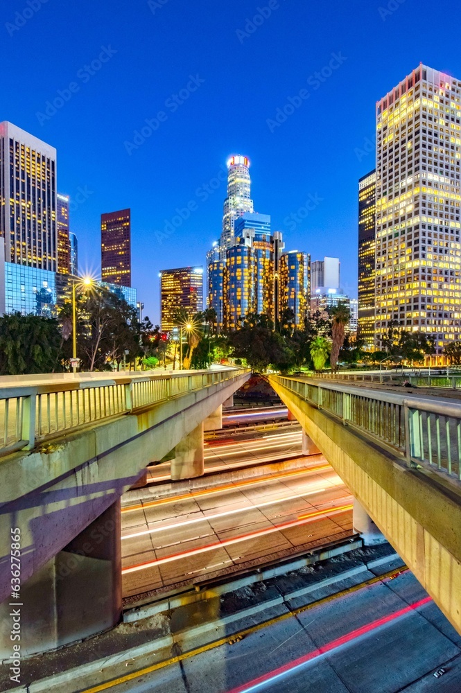 City Lights Aglow: 4K Image of Evening Traffic Flow on Road in Downtown Los Angeles