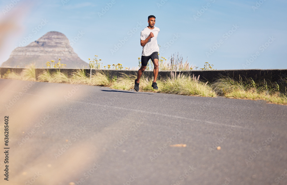 Man, running and training on road in mountain, nature or outdoor exercise and athlete in healthy wor