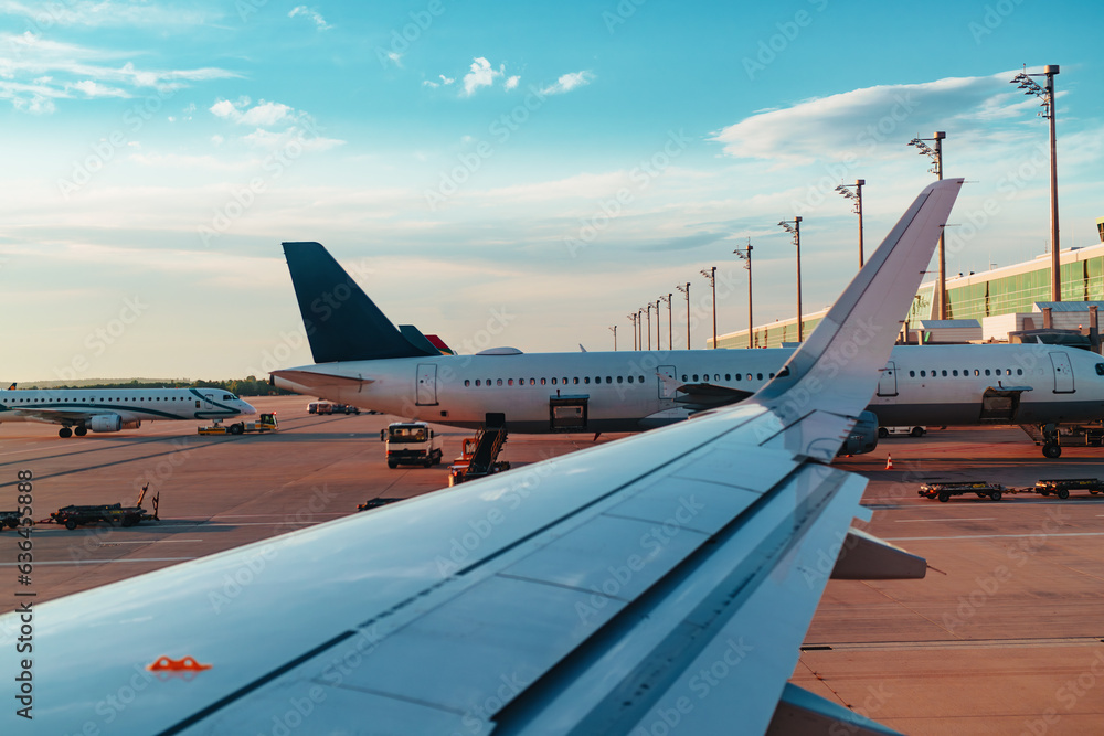 Passenger airplane on the runway at summer day