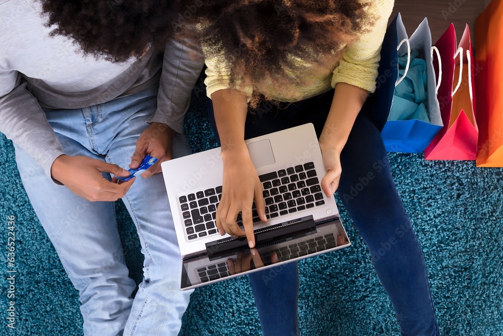 Young Couple Shopping Online On Laptop