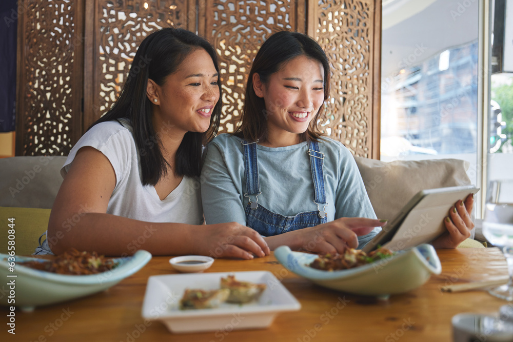 Asian friends, women and tablet for sushi, restaurant food menu and social media reviews in hospital