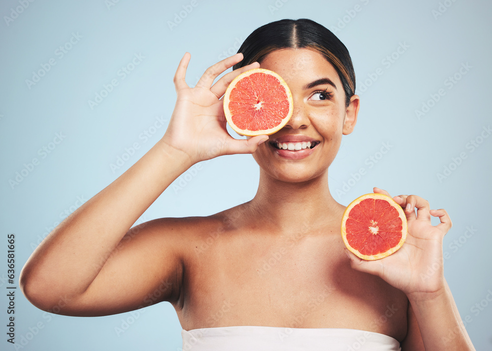 Smile, skincare and woman in studio with grapefruit for natural skin beauty or wellness on grey back