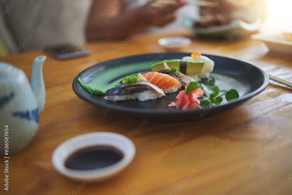 Sushi, food and chopsticks in a chinese restaurant closeup for fine dining or traditional cuisine. S