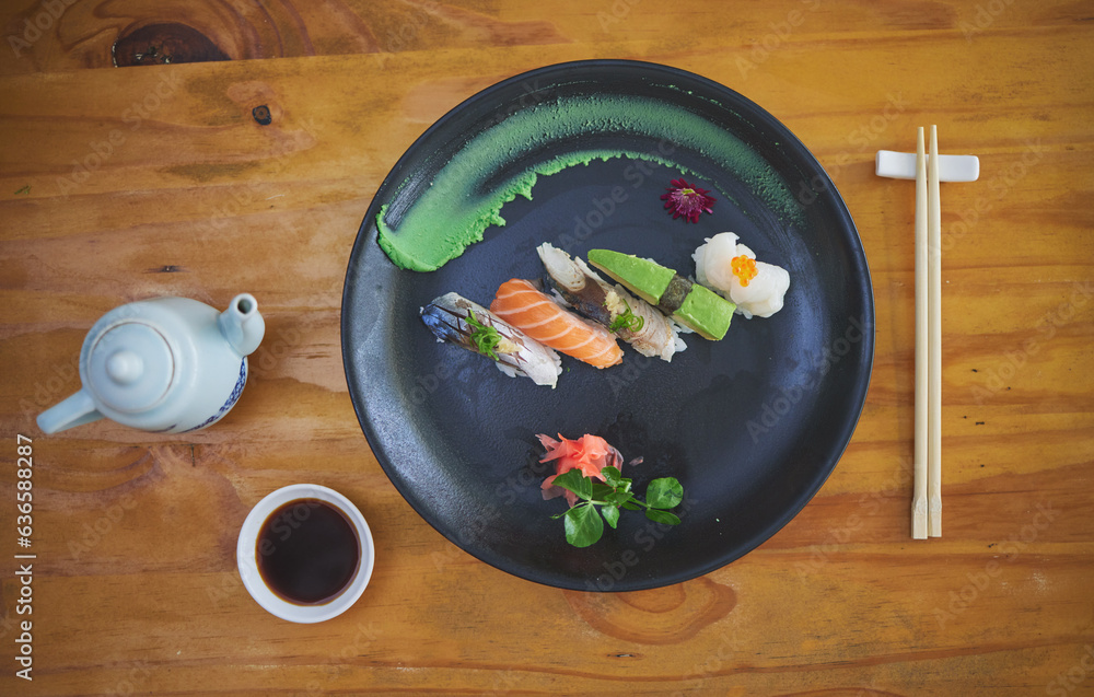 Sushi, seafood and chopsticks in a chinese restaurant from above for fine dining or traditional cuis