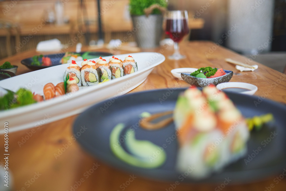 Sushi, chinese food and chopsticks in an asian restaurant closeup for fine dining or traditional cui