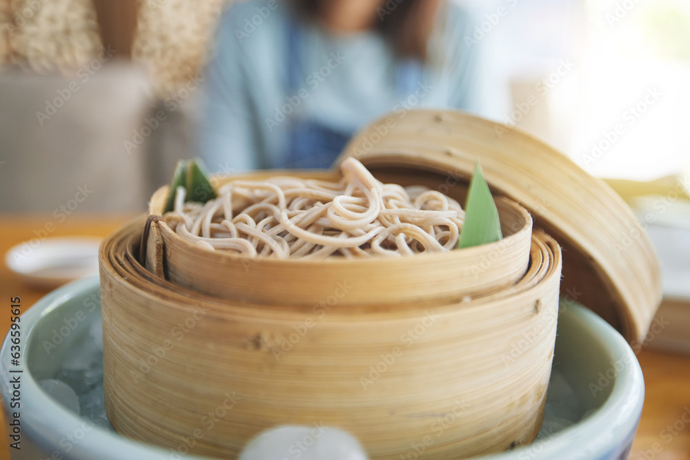 Restaurant, steamer and closeup of a bowl of noodles for healthy Asian cuisine for diet. Food, bambo