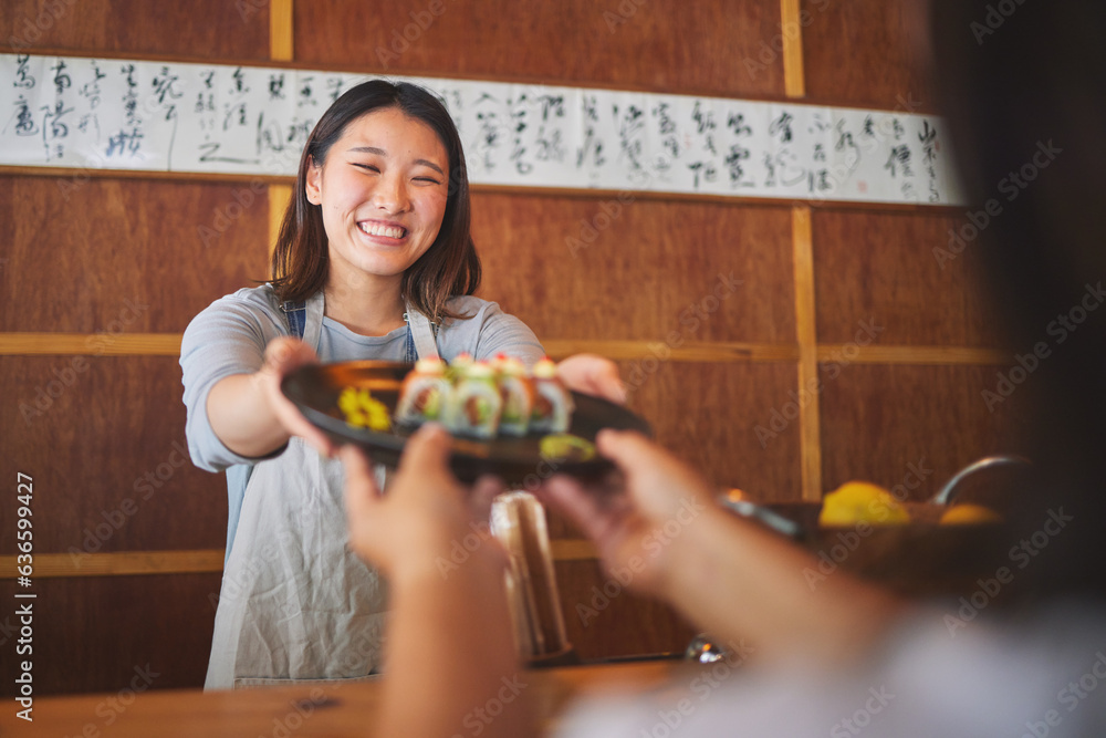 Sushi, restaurant worker and happy woman with serving food and Asian meal in a kitchen. Plate, femal