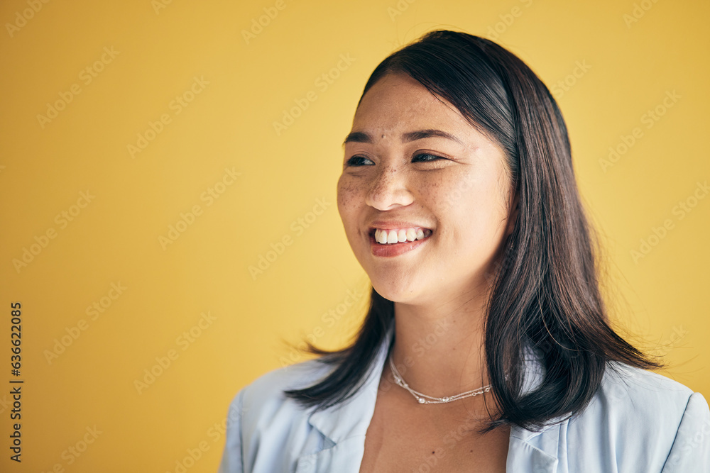 Thinking, smile and Asian woman in creative business studio isolated on a yellow background mockup s