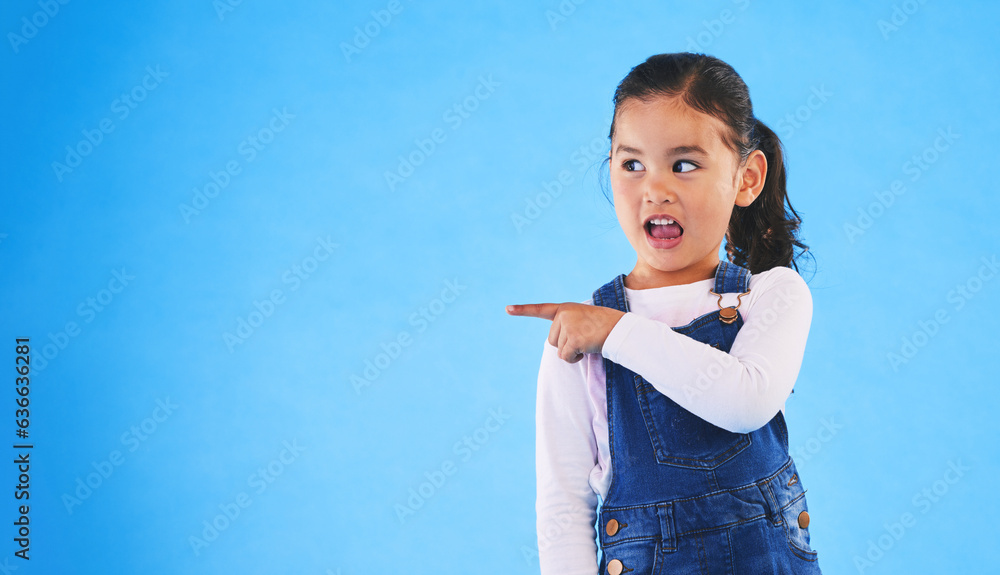 Pointing, blue background and girl with mockup space for sale, advertising and promotion. Emoji, hap