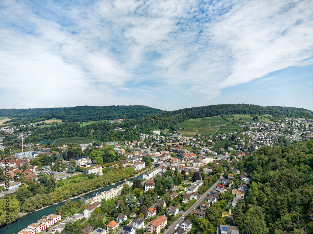 Aerial view of Swiss City of Baden with Industrial district, Limmat River and bridge on a sunny summ