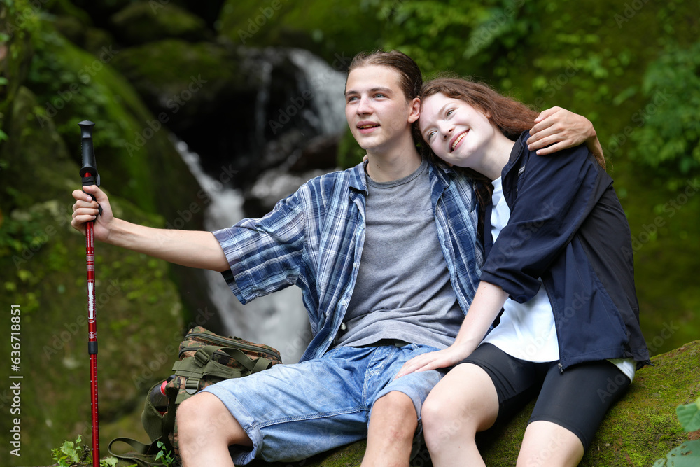 Adventure, travel, tourism, hike and people concept. Group of smiling friends with backpacks outdoor