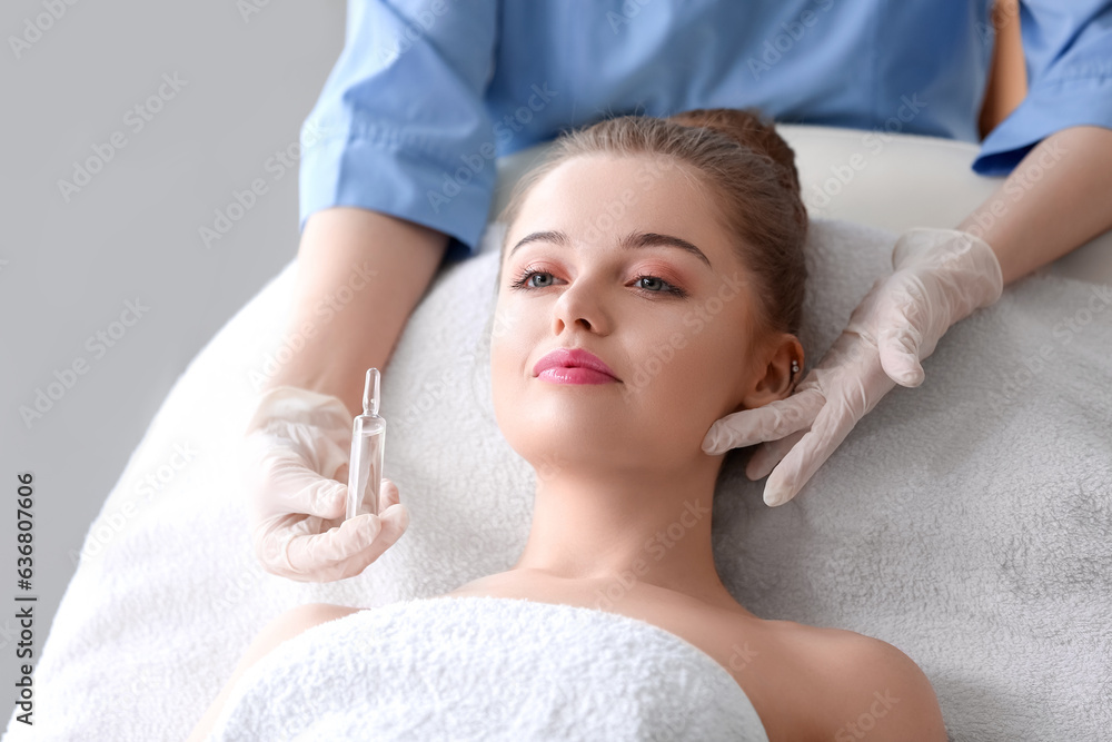 Young woman undergoing treatment in beauty salon. Skin care concept