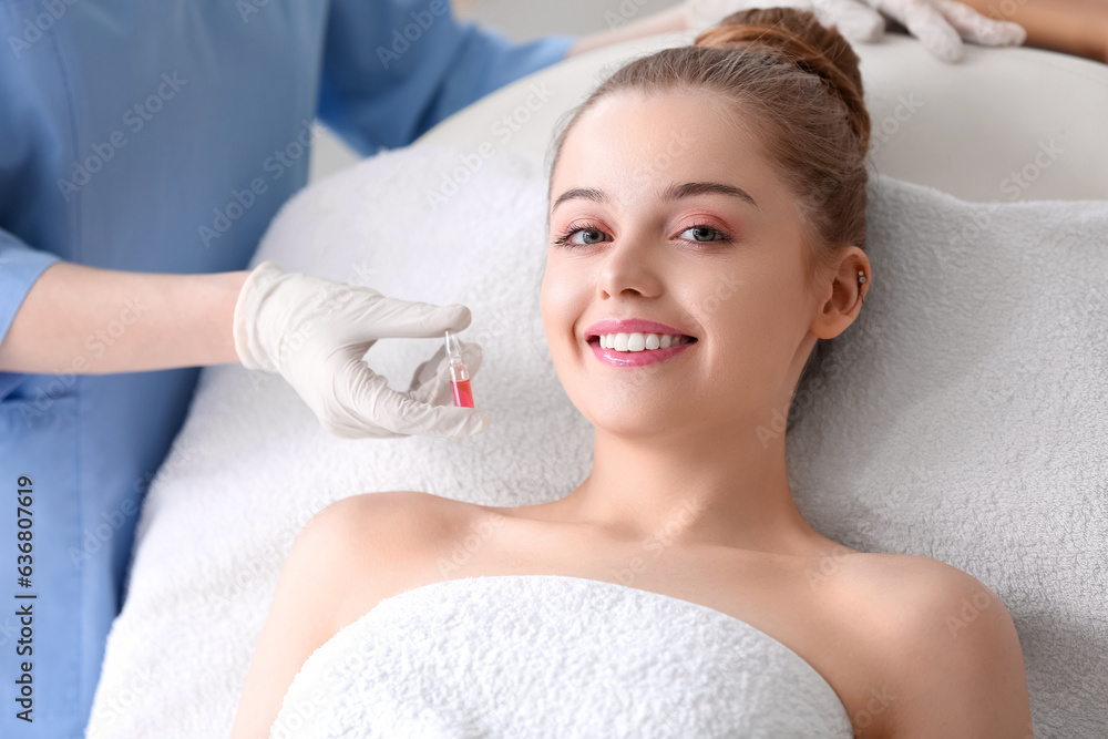 Young woman undergoing treatment in beauty salon. Skin care concept