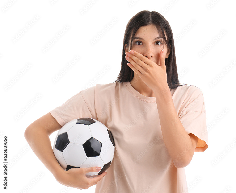 Surprised young woman with soccer ball on white background