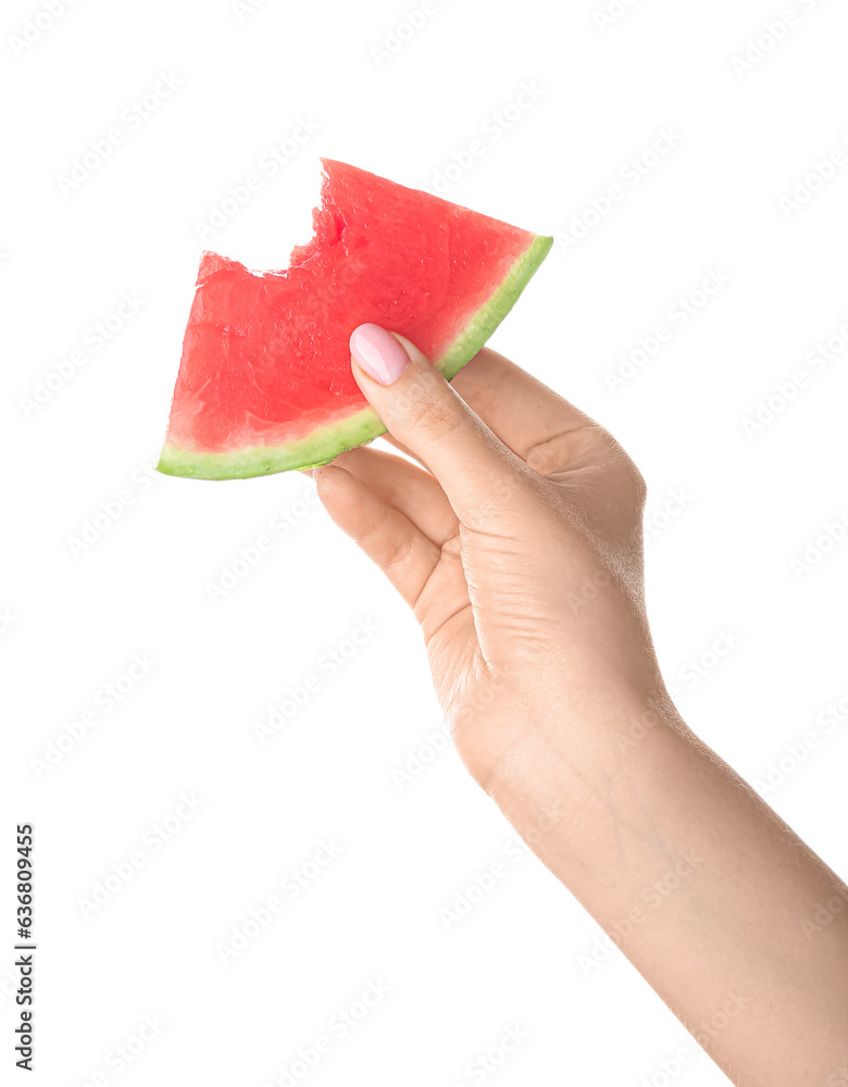 Female hand with bitten piece of ripe watermelon on white background