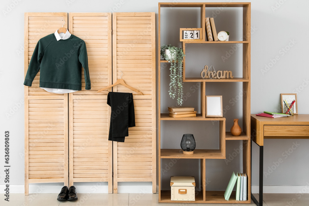 Interior of stylish modern room with school uniform