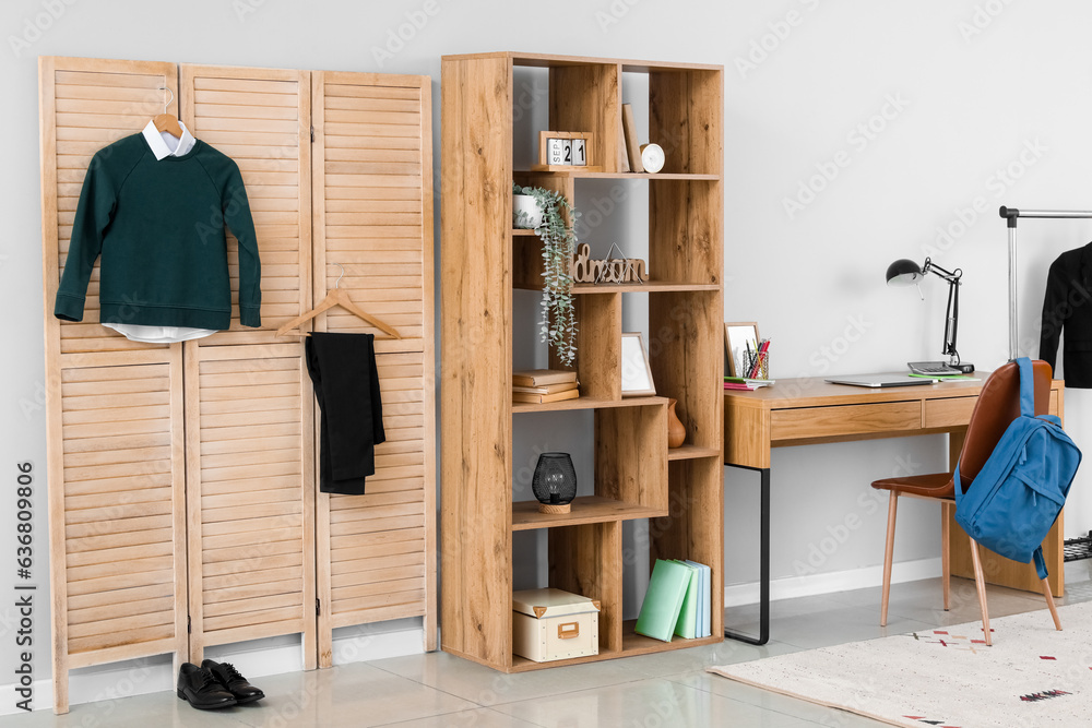 Interior of stylish modern room with school uniform