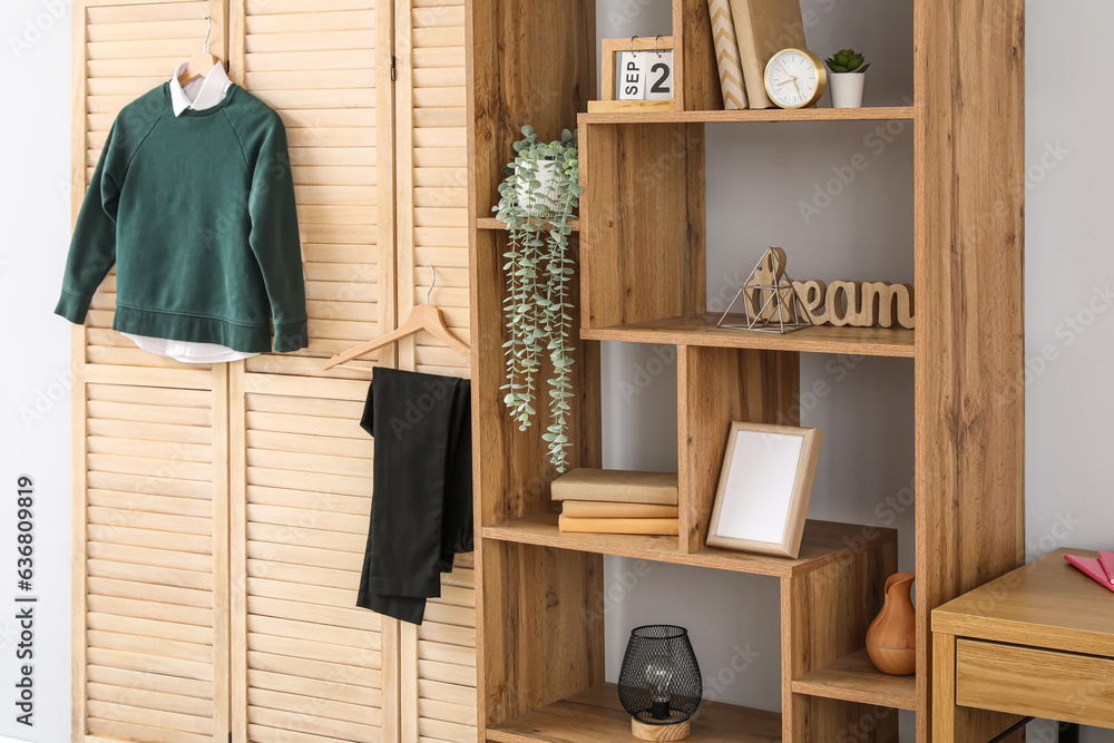 Interior of stylish modern room with school uniform