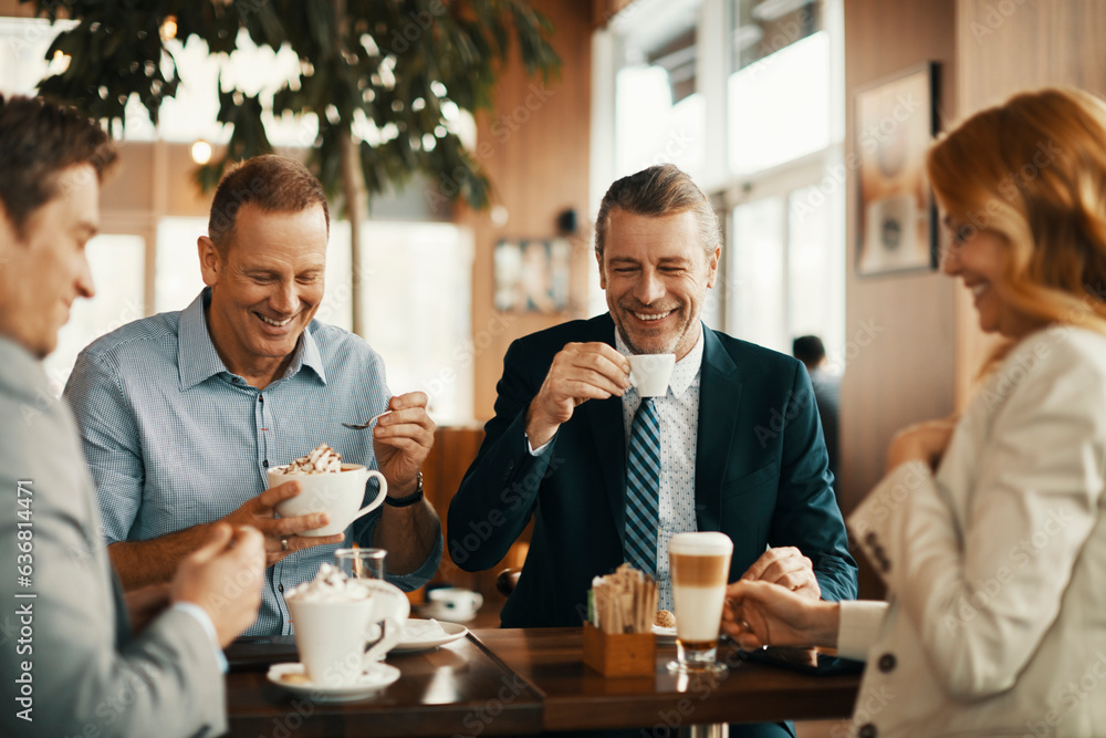 Group of business people having coffee and talking in a cafe decorated for the christmas and new yea