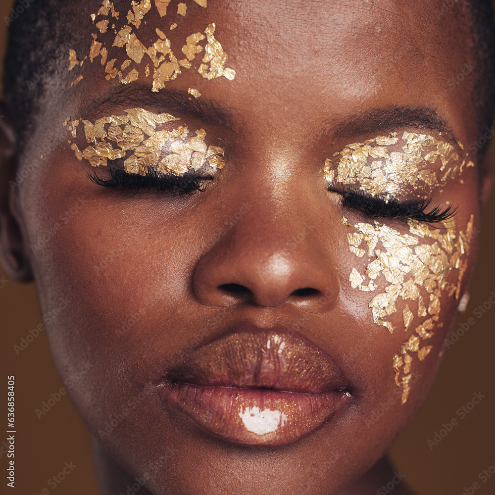 Gold, art and black woman with makeup for beauty aesthetics isolated in a studio brown background ey