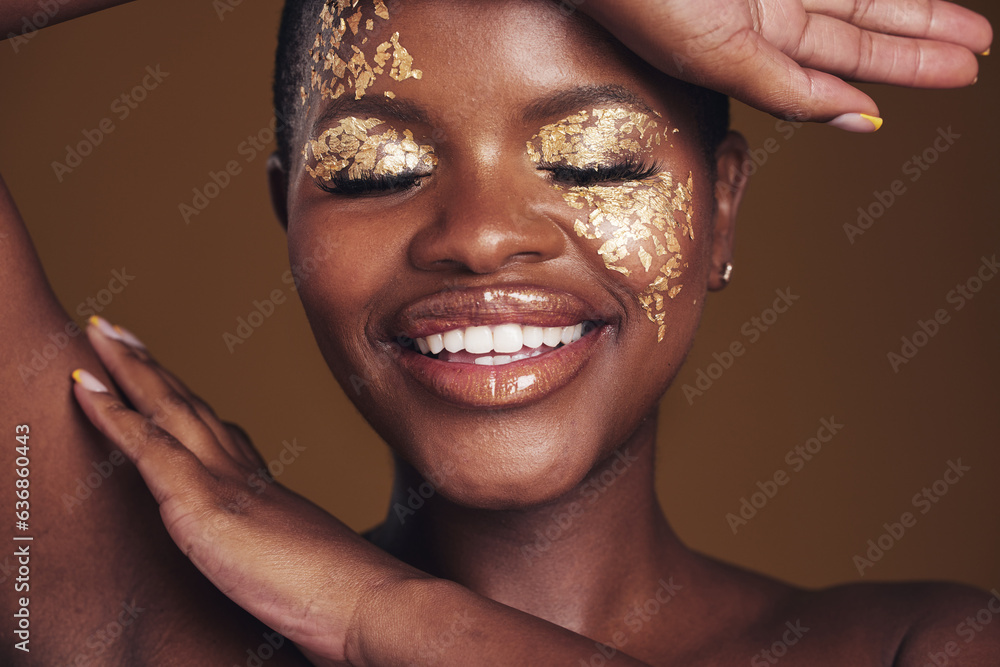 Gold, creative and art on black woman face with makeup for beauty aesthetics isolated in a studio br