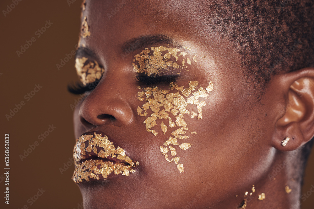 Gold, beauty and black woman with makeup for aesthetic isolated in a studio brown background eyes cl