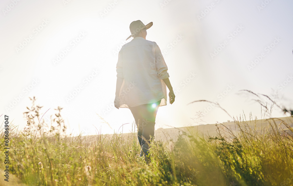 Back, agriculture and a woman walking on a farm for sustainability or growth in the morning with fla