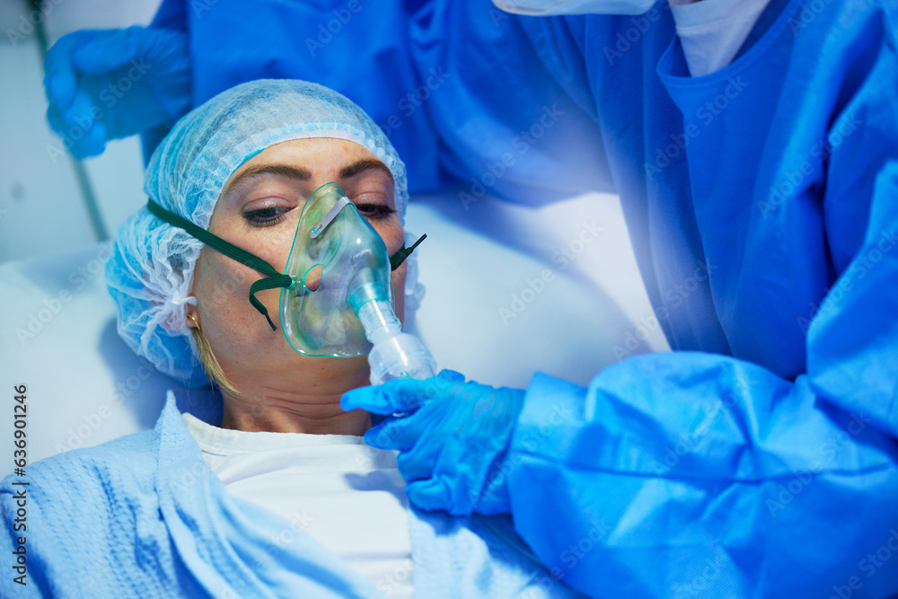 Surgery, anesthesia and doctor with woman with oxygen mask for medical service, operation and proced