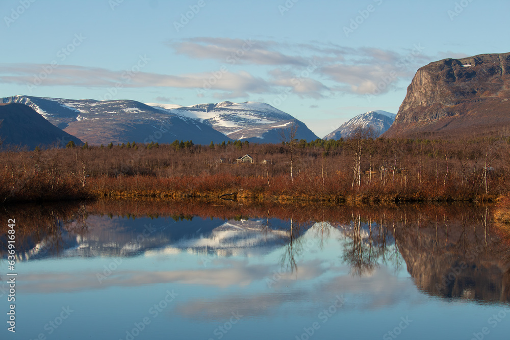 Mountains near Kebnekaise, Sweden, in october, clear sky, snowcapped peak, reflection on the lake