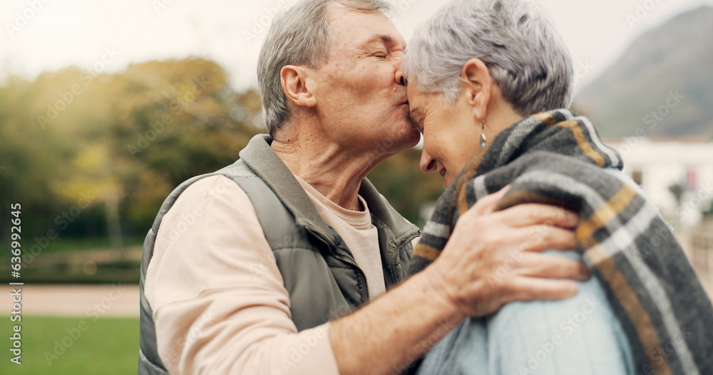 Forehead, kiss and senior couple in a park with love, happy and conversation with romantic bonding. 