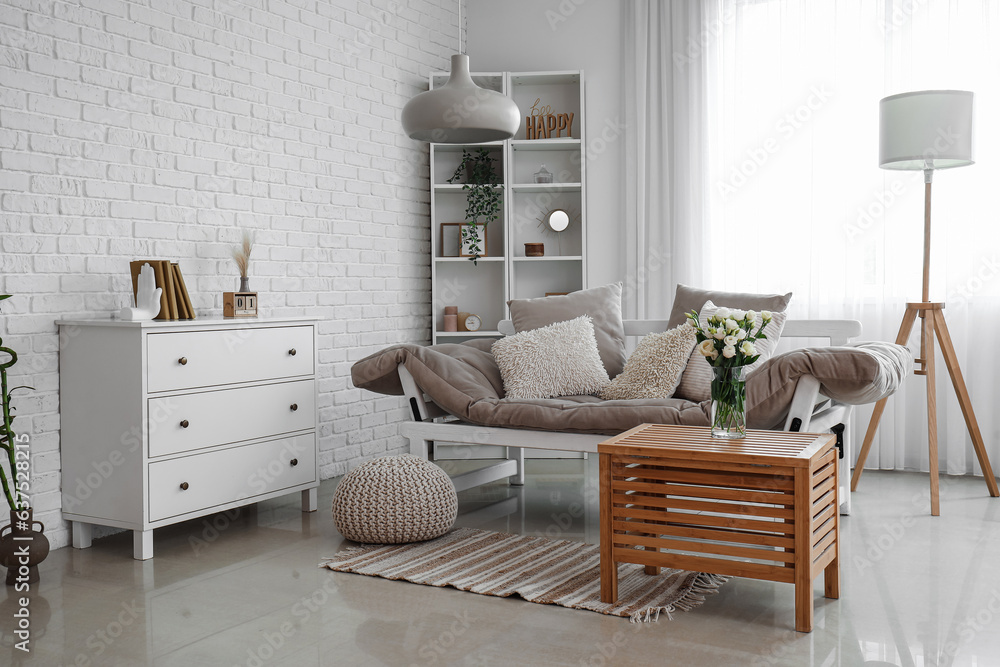 Interior of room with shelving unit and stylish holder for books near white wall